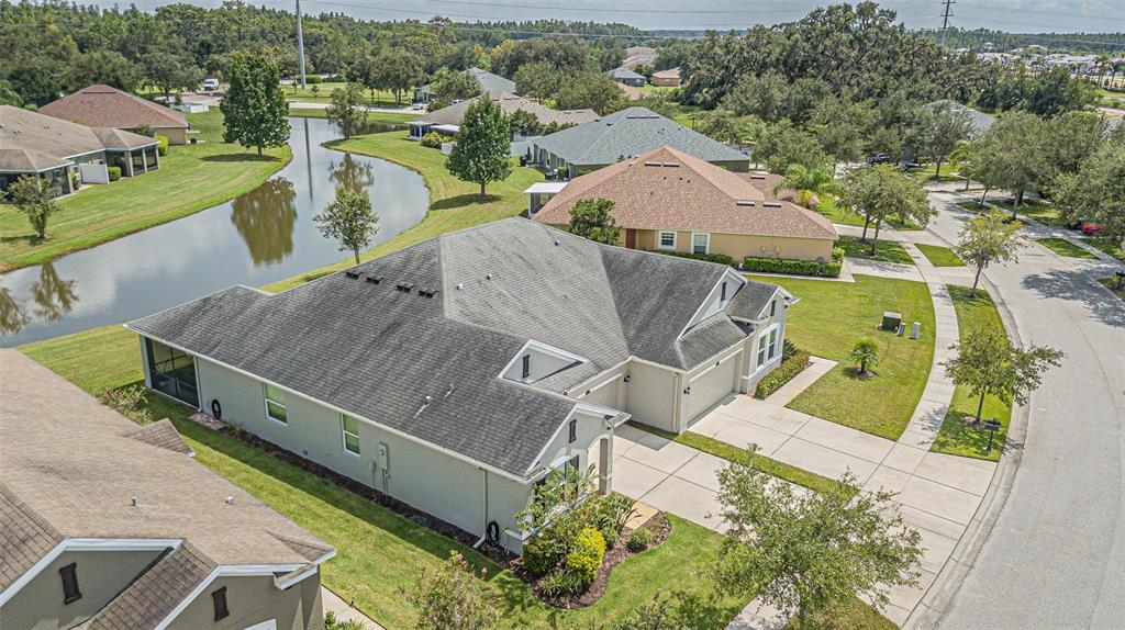 4256 Ashton Meadows Way Wesley Chapel, FL 33543 - Photo 34 of 42 an aerial view of a house with a garden