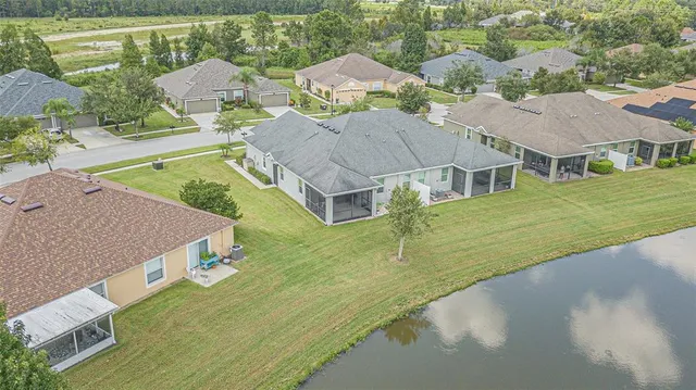 an aerial view of houses with outdoor space