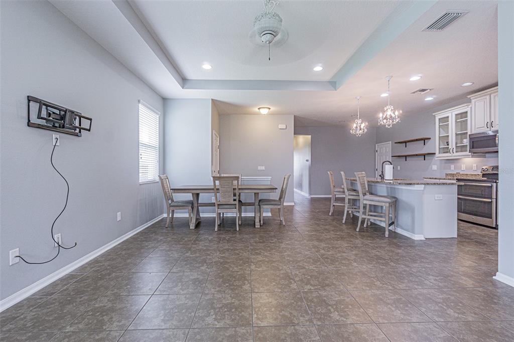 4256 Ashton Meadows Way Wesley Chapel, FL 33543 - Photo 8 of 42 a view of a room with chairs and tables