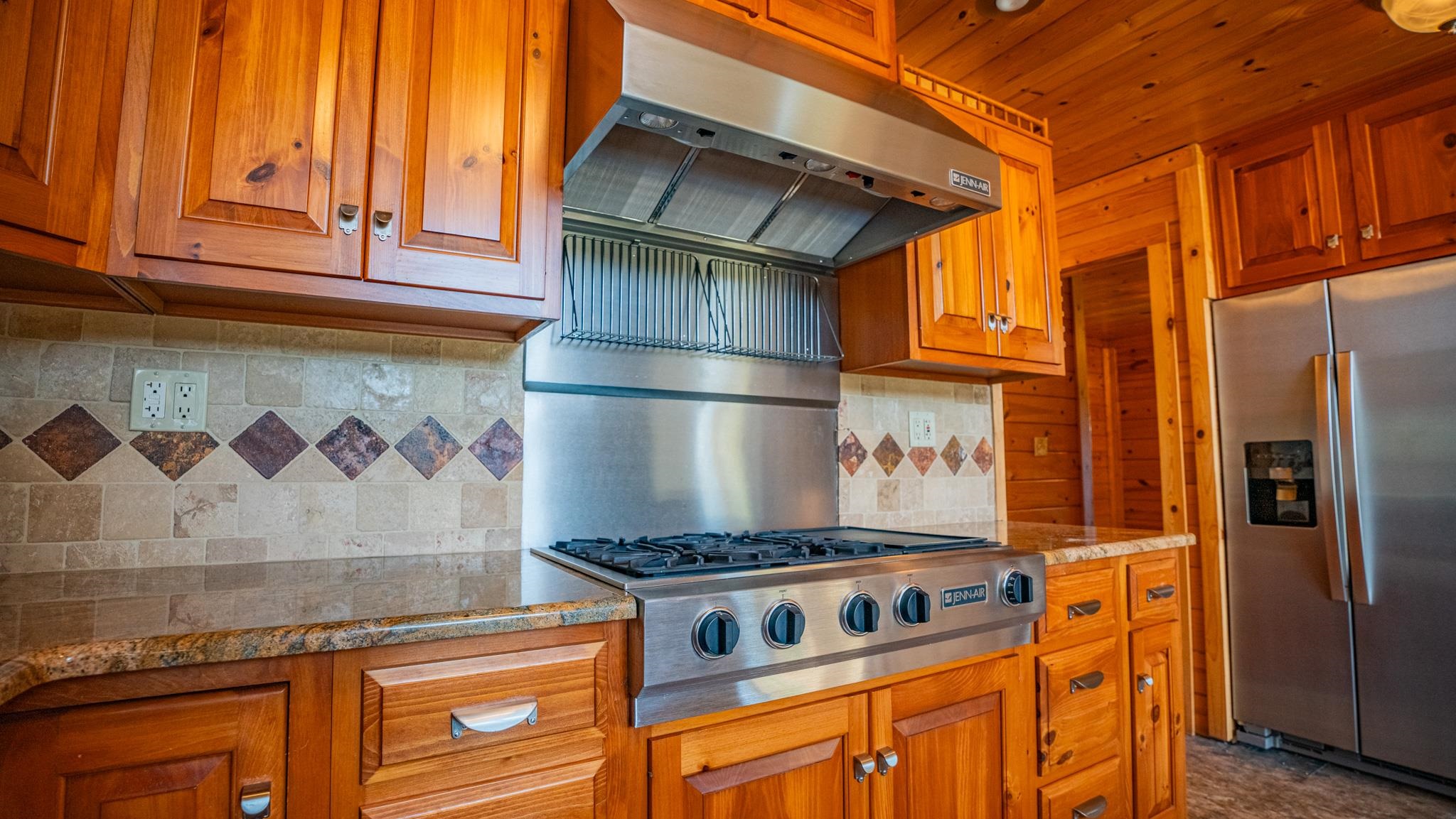 13582 West Springdale Road Forreston, IL 61030 - Photo 23 of 77 a kitchen with stainless steel appliances granite countertop a stove and a refrigerator