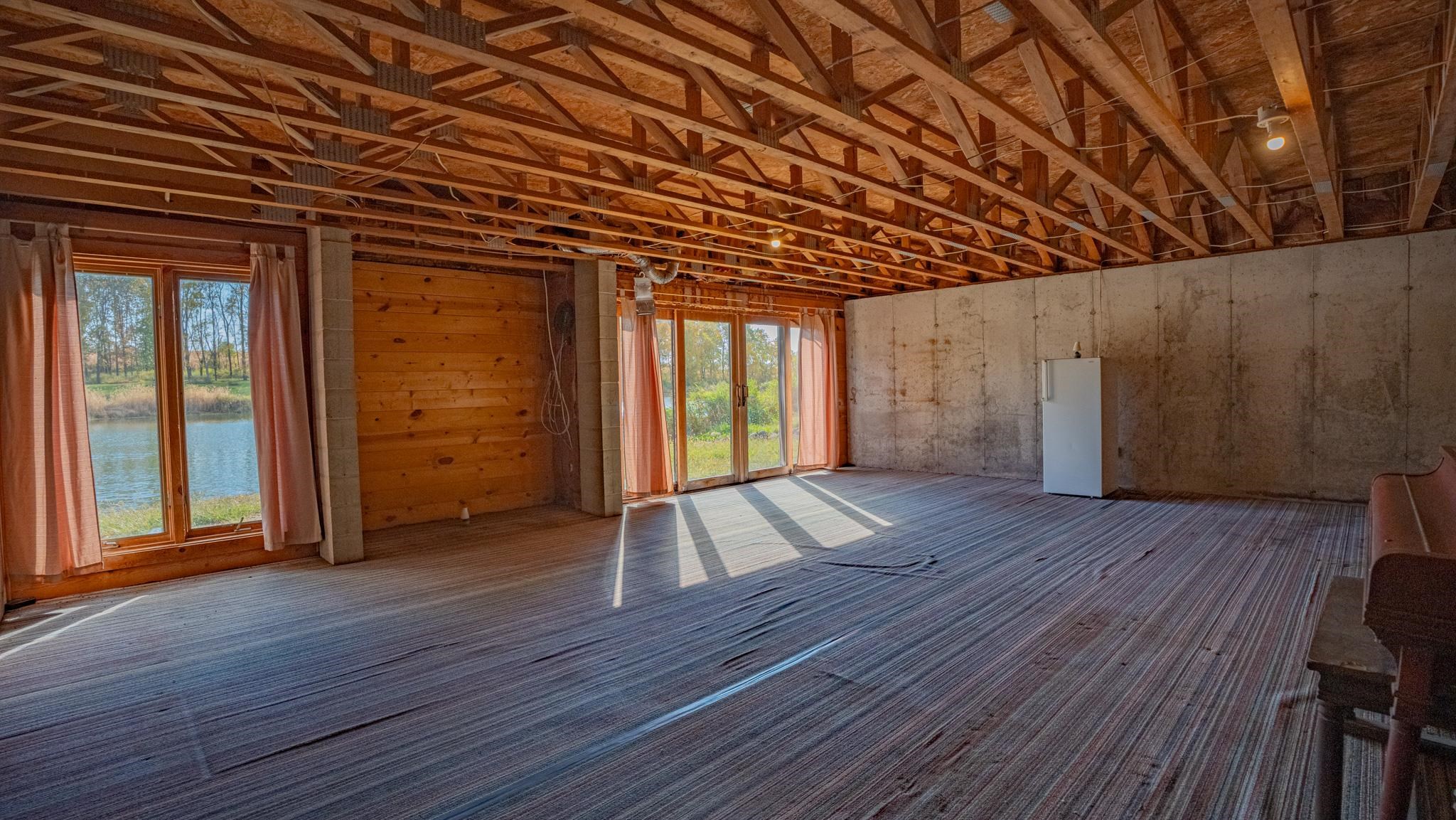 13582 West Springdale Road Forreston, IL 61030 - Photo 37 of 77 an empty room with wooden floor and windows