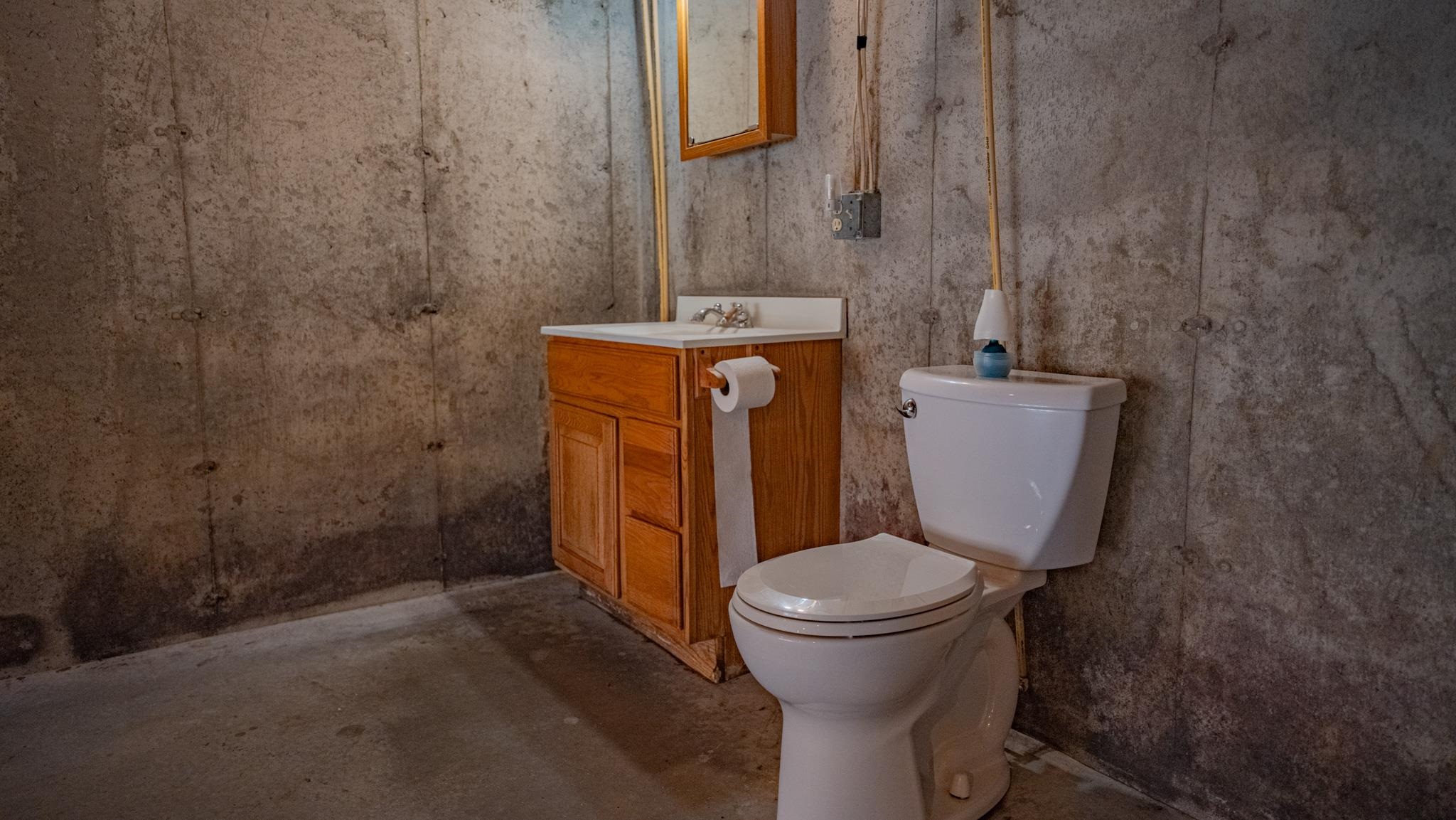 13582 West Springdale Road Forreston, IL 61030 - Photo 42 of 77 a bathroom with a toilet and a sink