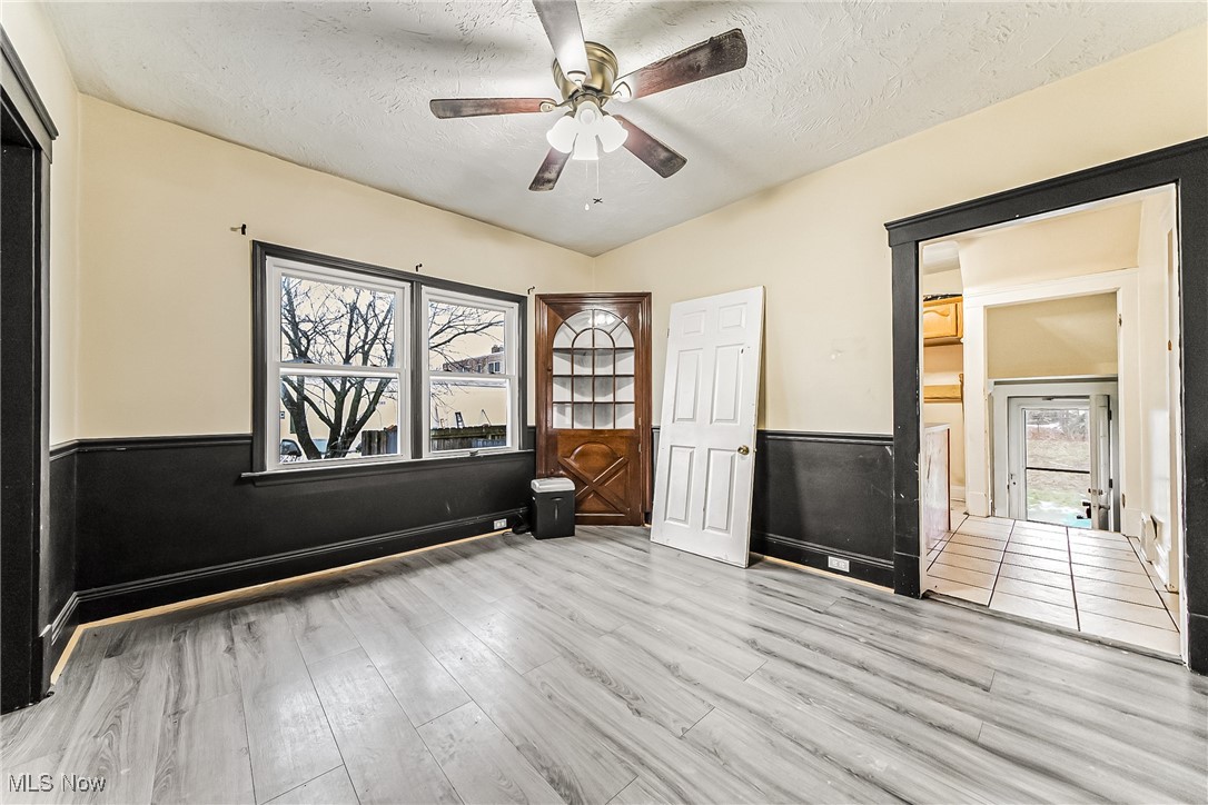 2014 Cook Avenue Cleveland, OH 44109 - Photo 8 of 37 Spare room featuring ceiling fan, light hardwood / wood-style floors, and a textured ceiling