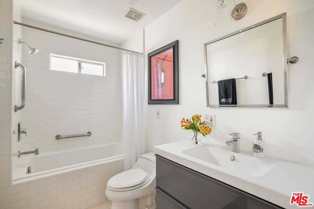 970 West Lehigh Street Altadena, CA 91001 - Photo 16 of 33 a bathroom with a toilet sink and mirror