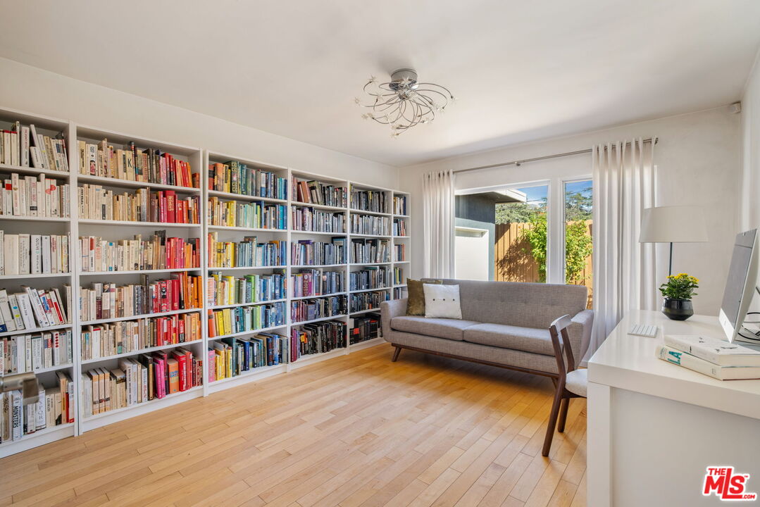 970 West Lehigh Street Altadena, CA 91001 - Photo 18 of 33 a living room with furniture and a book shelf