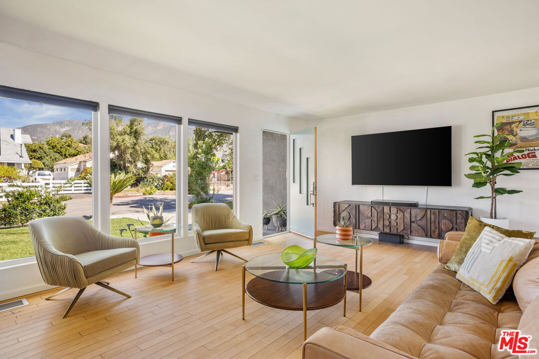 970 West Lehigh Street Altadena, CA 91001 - Photo 4 of 33 a living room with furniture and a flat screen tv