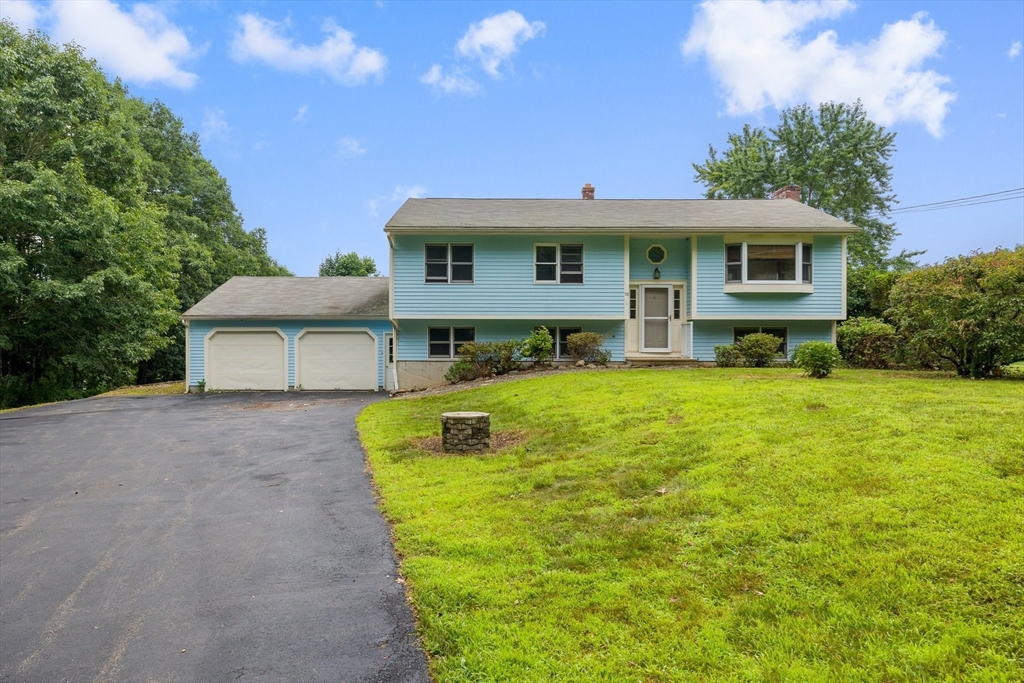 98 Fitzgerald Road Charlton, MA 01507 - Photo 1 of 27 a front view of a house with garden