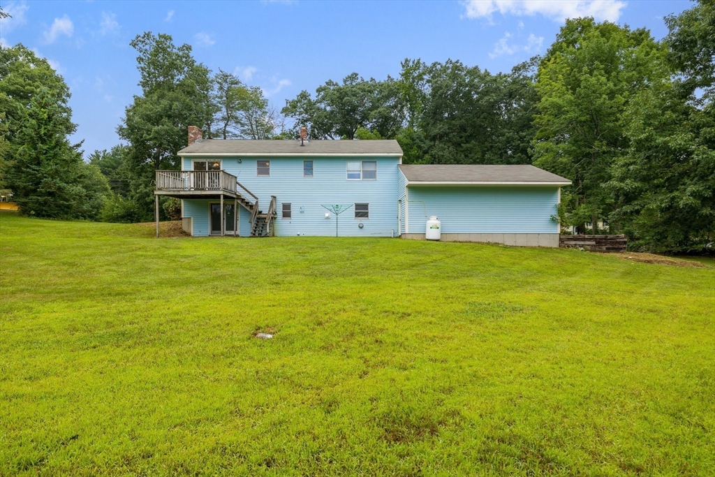 98 Fitzgerald Road Charlton, MA 01507 - Photo 26 of 27 a view of a house with a yard