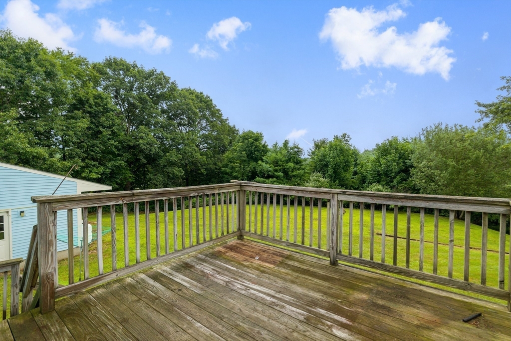 98 Fitzgerald Road Charlton, MA 01507 - Photo 10 of 27 a view of balcony with wooden floor and fence