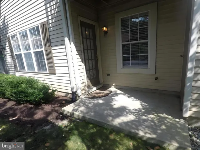 a view of backyard with windows