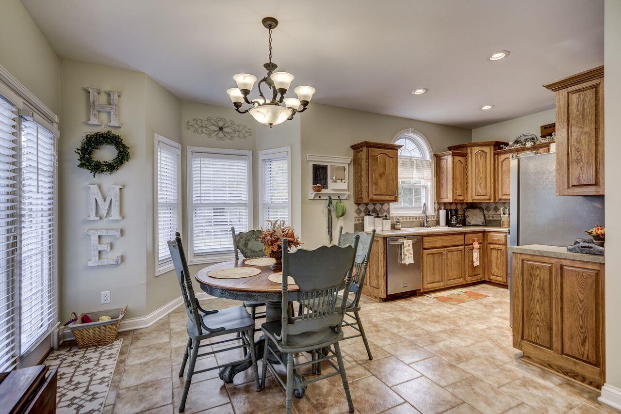 1105 North Corinth Road Portland, TN 37148 - Photo 5 of 16 a view of a dining room with furniture and chandelier