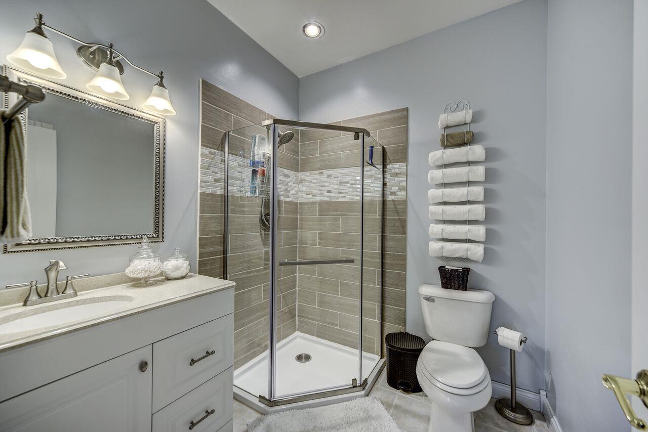 1105 North Corinth Road Portland, TN 37148 - Photo 7 of 16 a bathroom with a sink toilet and shower