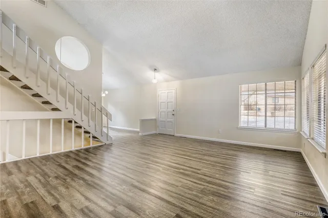 a view of an entryway with wooden floor
