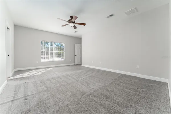 a view of a livingroom with stairs