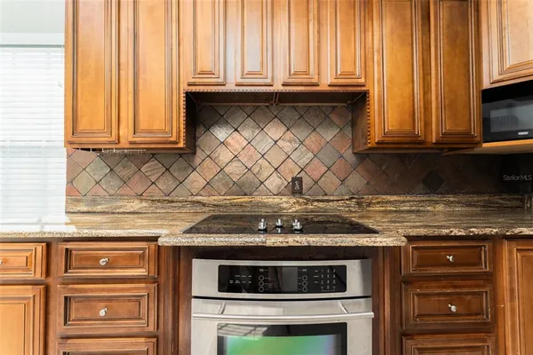 a view of a livingroom with wooden floor and a fireplace