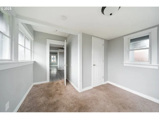 a big room with windows and closet