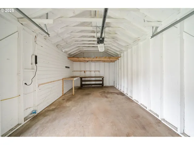 a view of a room with stairs and white walls
