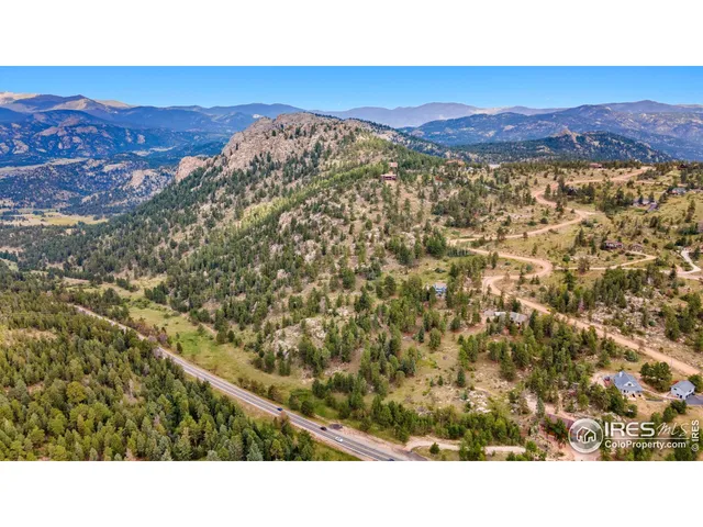 a open area with mountains in the background
