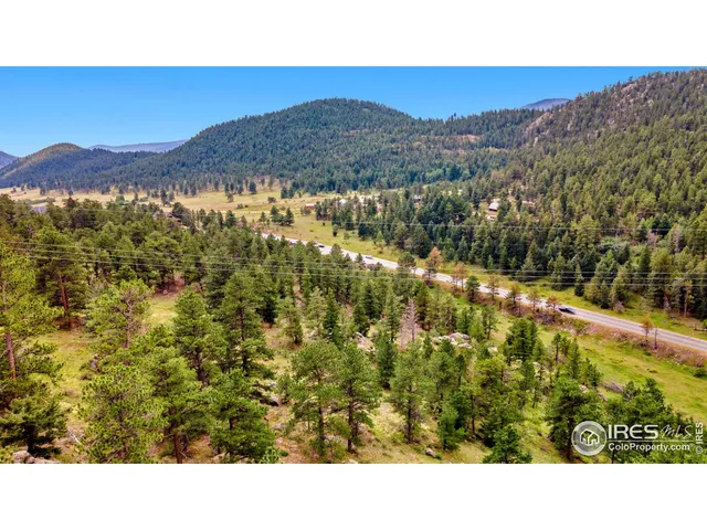 a open area with a mountain in the background