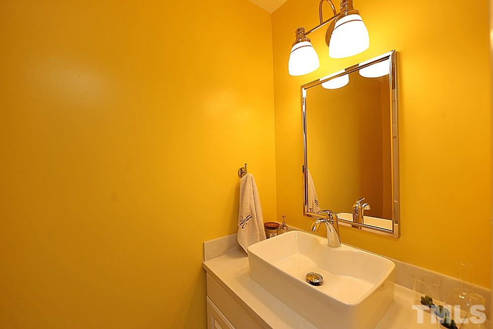 2204 Quail Ridge Road Raleigh, NC 27609 - Photo 11 of 25 a bathroom with a sink and a mirror