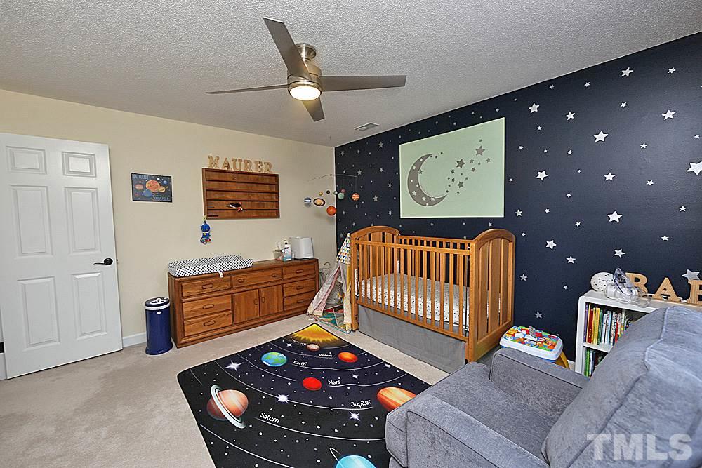 2204 Quail Ridge Road Raleigh, NC 27609 - Photo 16 of 25 a bedroom with furniture and a window