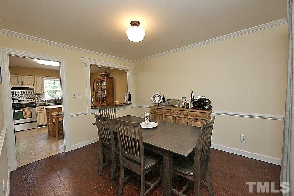 2204 Quail Ridge Road Raleigh, NC 27609 - Photo 3 of 25 a view of a dining room with furniture and wooden floor
