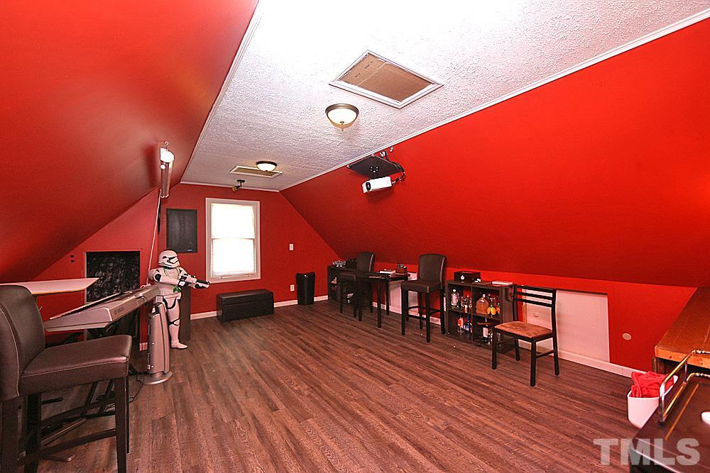 2204 Quail Ridge Road Raleigh, NC 27609 - Photo 21 of 25 a view of a room with furniture and wooden floor