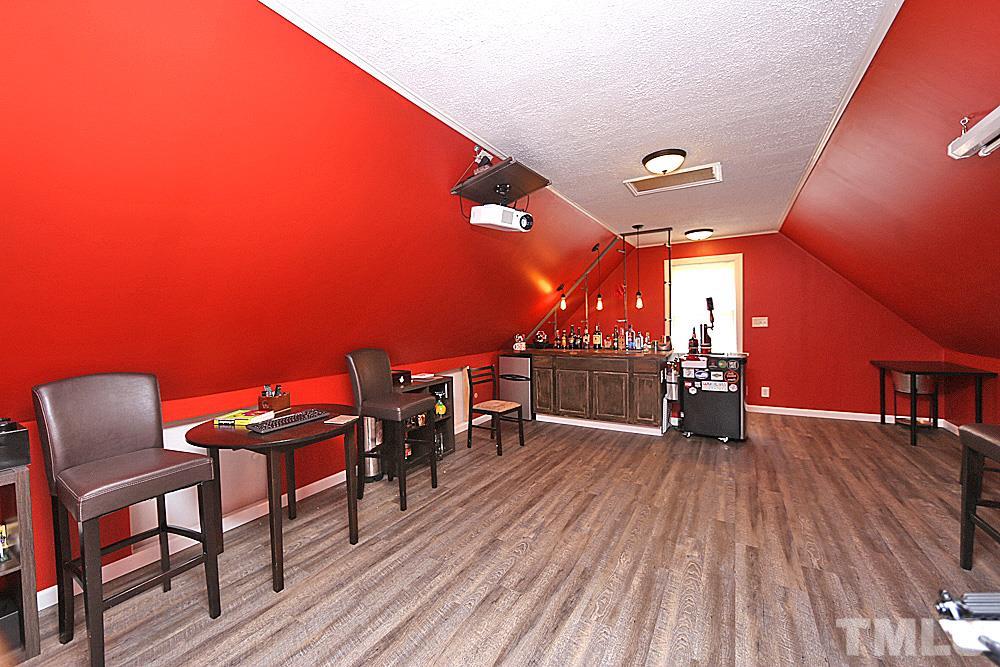 2204 Quail Ridge Road Raleigh, NC 27609 - Photo 22 of 25 a view of a chairs and table on the wooden floor