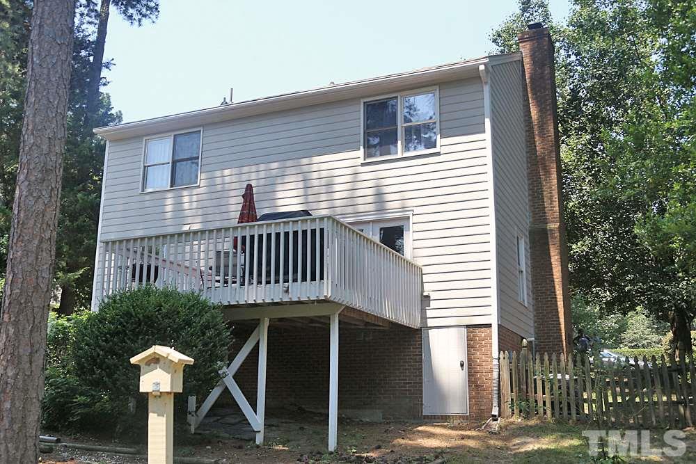 2204 Quail Ridge Road Raleigh, NC 27609 - Photo 24 of 25 a view of a house with backyard and plants