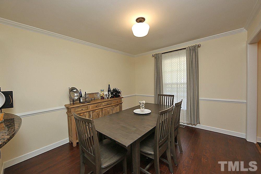 2204 Quail Ridge Road Raleigh, NC 27609 - Photo 4 of 25 a view of a dining room with furniture and wooden floor