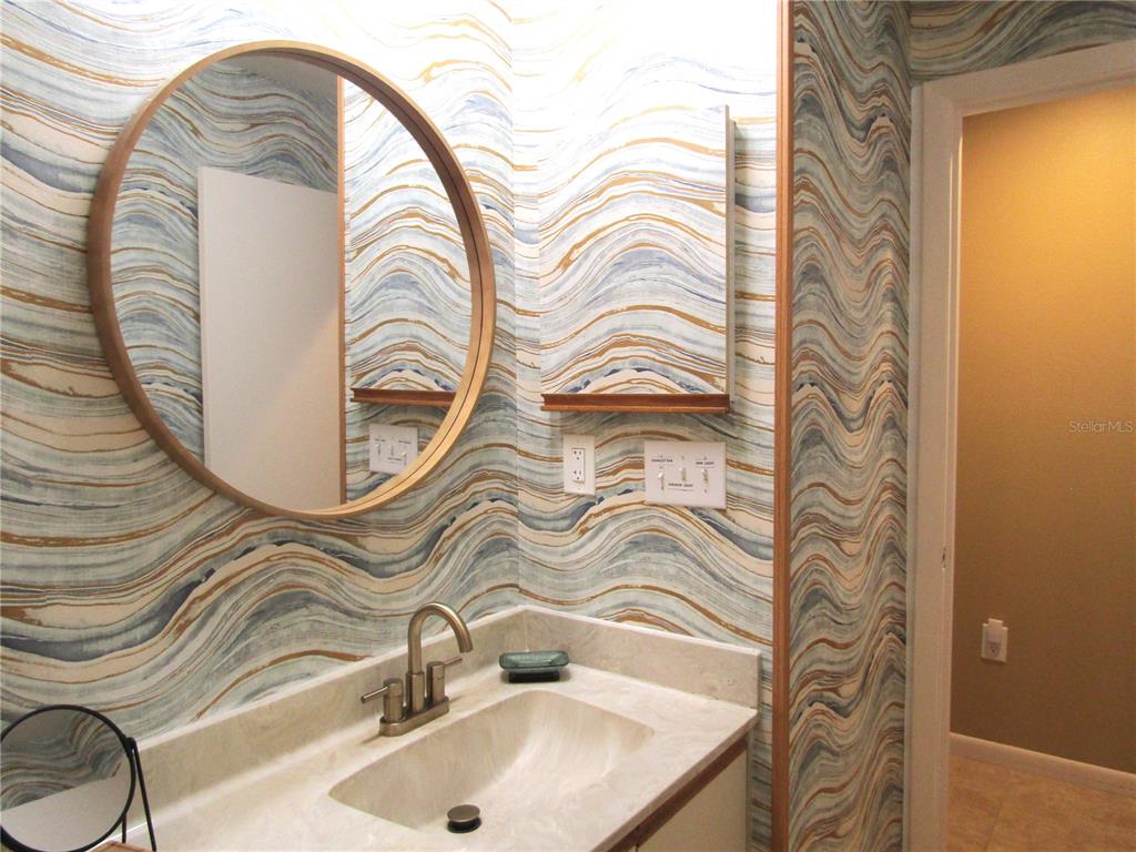 4521 Morningside, Unit 6 Sarasota, FL 34235 - Photo 14 of 22 a bathroom with a sink and a mirror