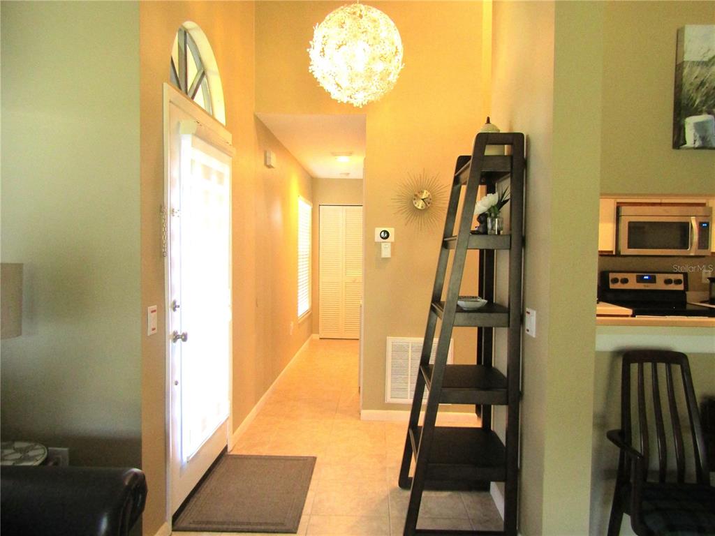 4521 Morningside, Unit 6 Sarasota, FL 34235 - Photo 7 of 22 a view of an entryway with wooden floor