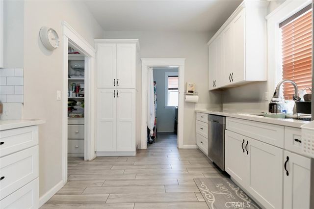 a bathroom with a bathtub a sink a vanity a mirror and a shower