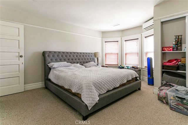 a room with furniture and dresser