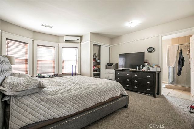 a bathroom with a shower and a glass door