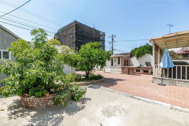 a front view of a house with large windows