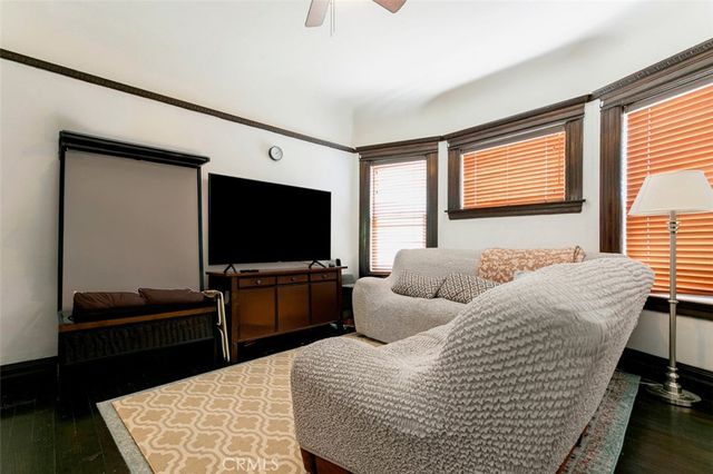 a view of a dining room with furniture and window