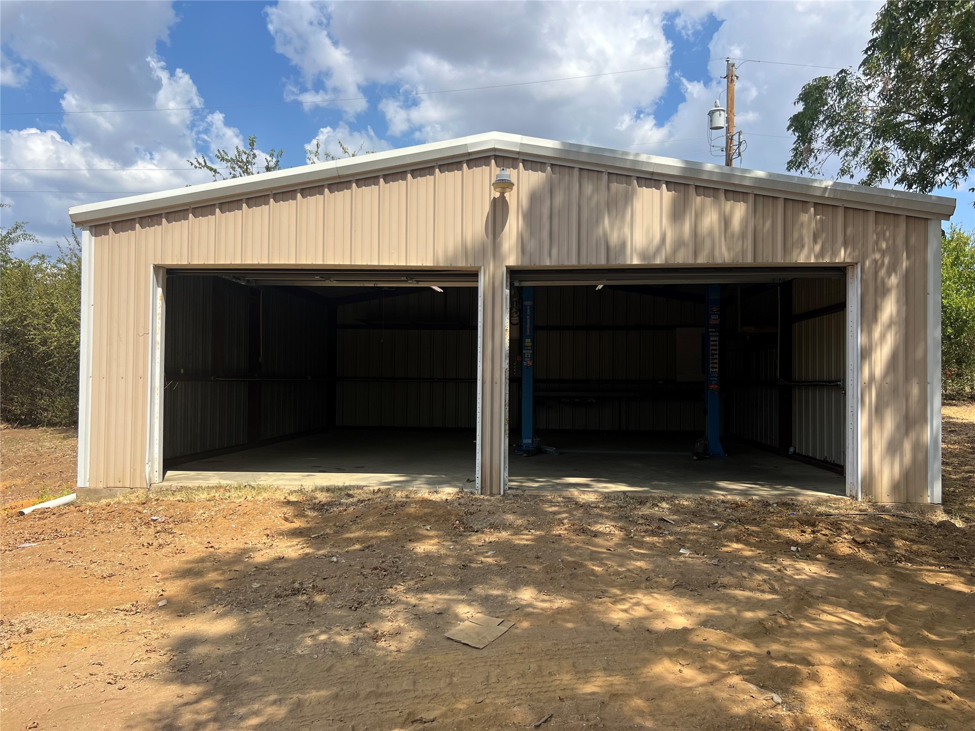903 South 3rd Street Calera, OK 74730 - Photo 3 of 5 Two-bay metal structure with a concrete slab foundation