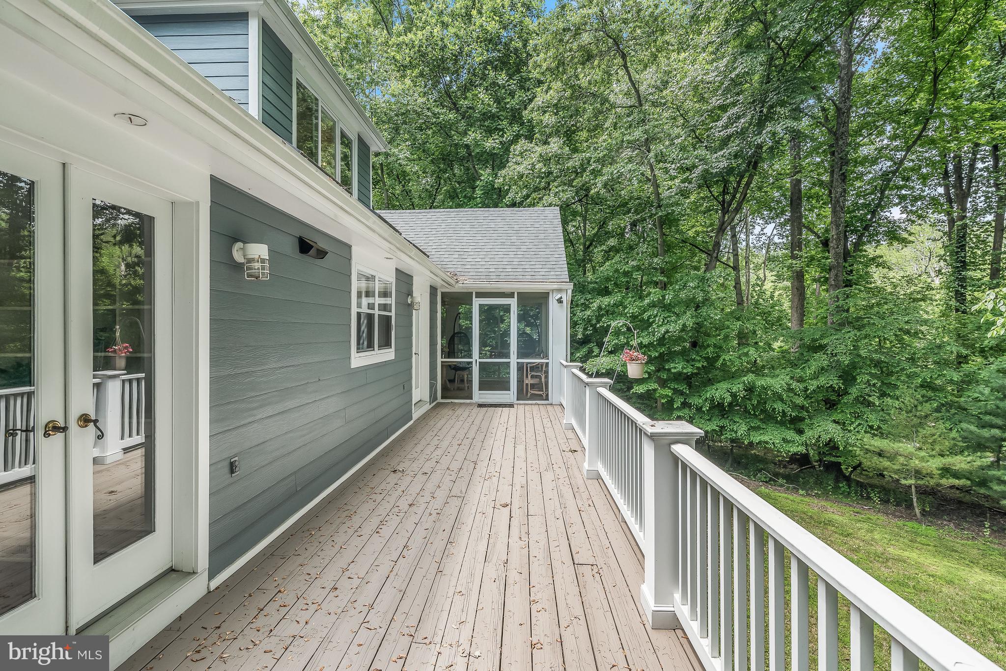 4240 Blue Barrow Ride Ellicott City, MD 21042 - Photo 34 of 86 Deck & Adjacent Screened Porch