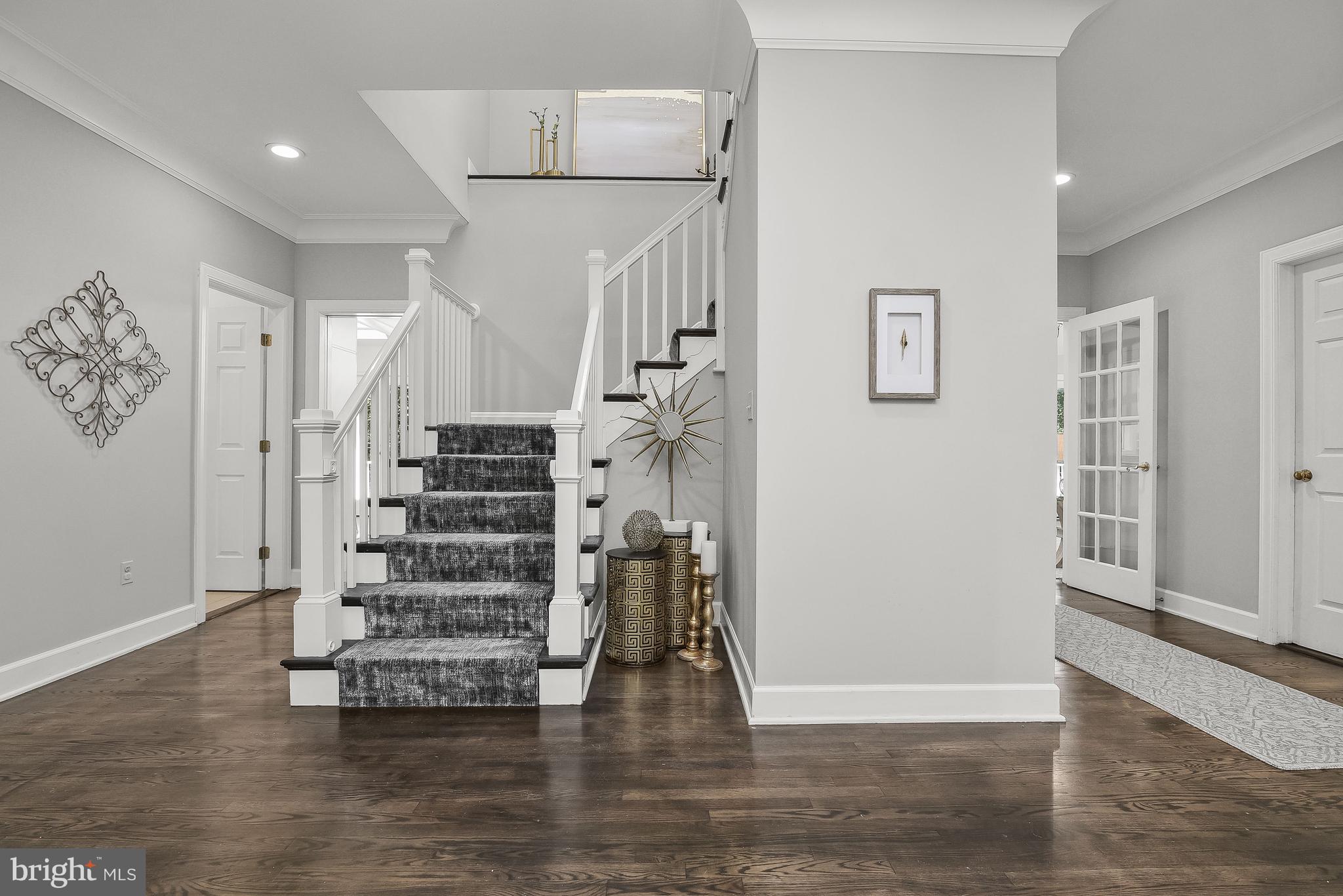 4240 Blue Barrow Ride Ellicott City, MD 21042 - Photo 6 of 86 Extended Foyer & Winding Stair