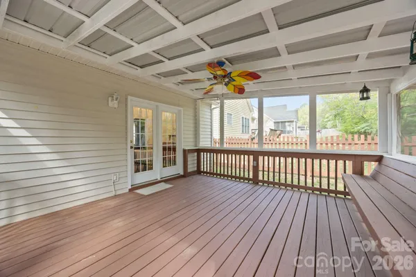 a view of a porch with wooden floor