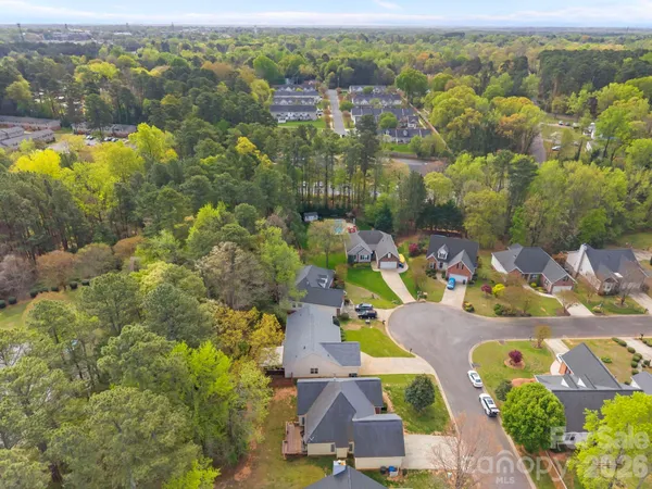 an aerial view of residential house with outdoor space and swimming pool