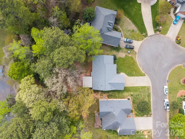 an aerial view of a house with a garden