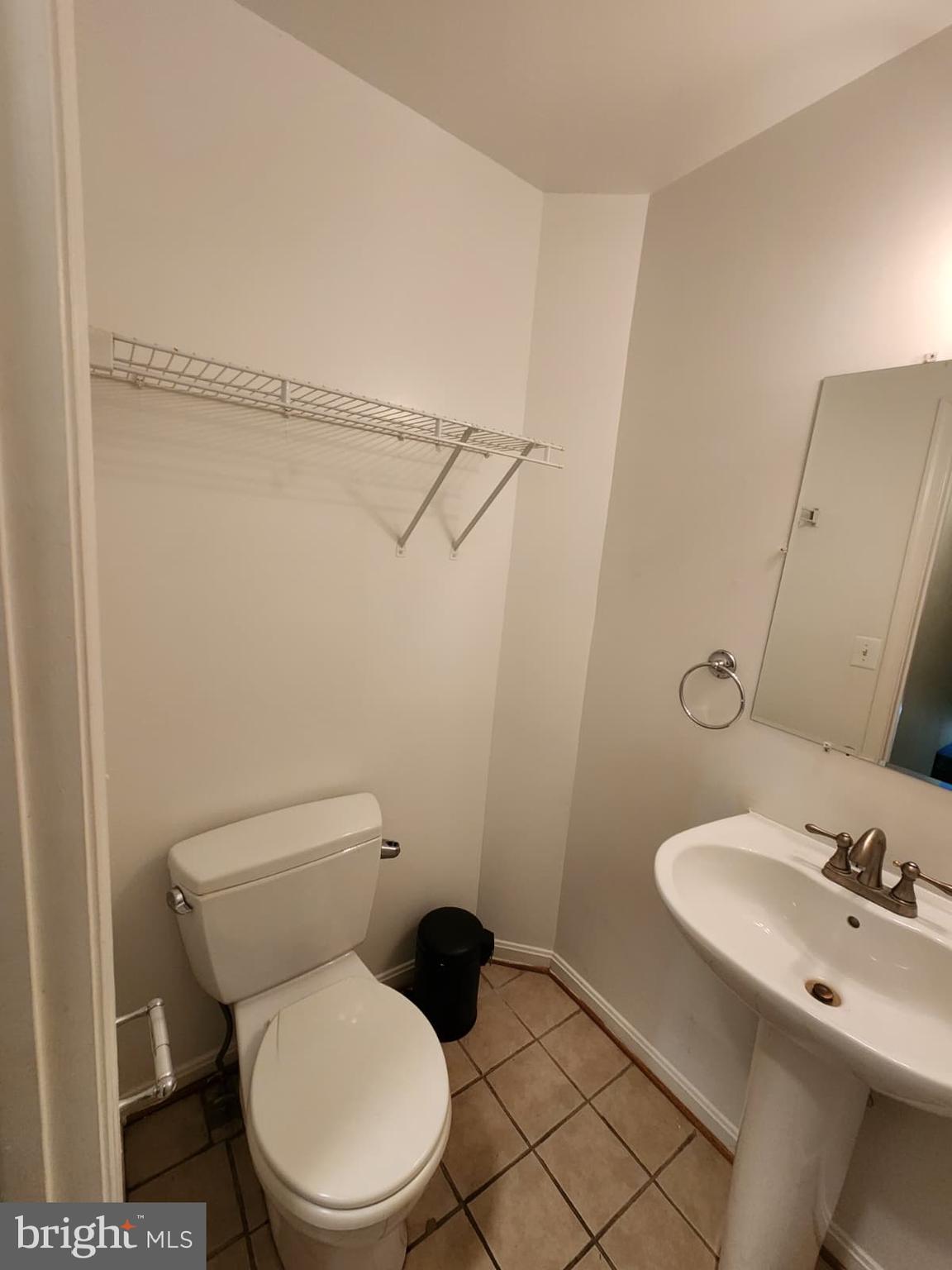 45033 Fellowship Square Ashburn, VA 20147 - Photo 15 of 37 a white toilet sitting next to a bathroom sink