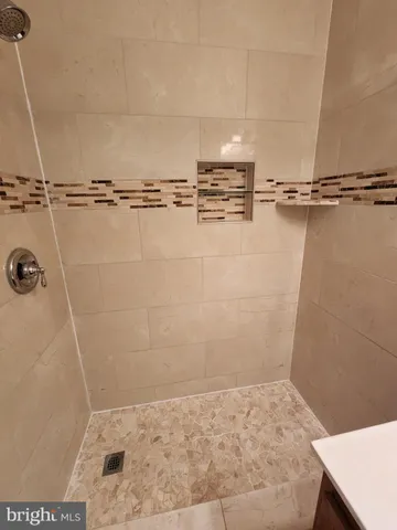 a bathroom with a sink toilet and mirror