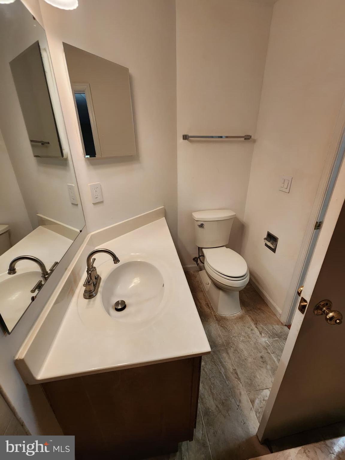 45033 Fellowship Square Ashburn, VA 20147 - Photo 17 of 37 a bathroom with a sink toilet and mirror
