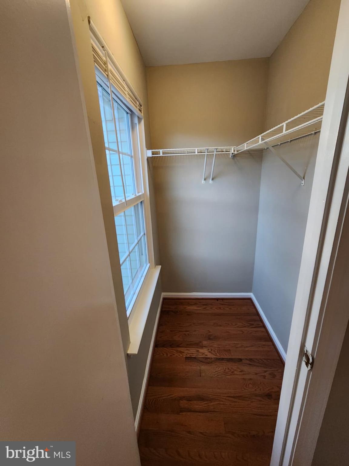 45033 Fellowship Square Ashburn, VA 20147 - Photo 24 of 37 a view of an empty room with wooden floor and stairs