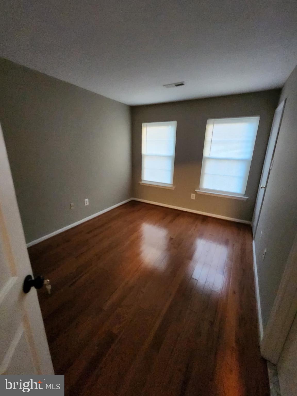 45033 Fellowship Square Ashburn, VA 20147 - Photo 26 of 37 an empty room with wooden floor and windows