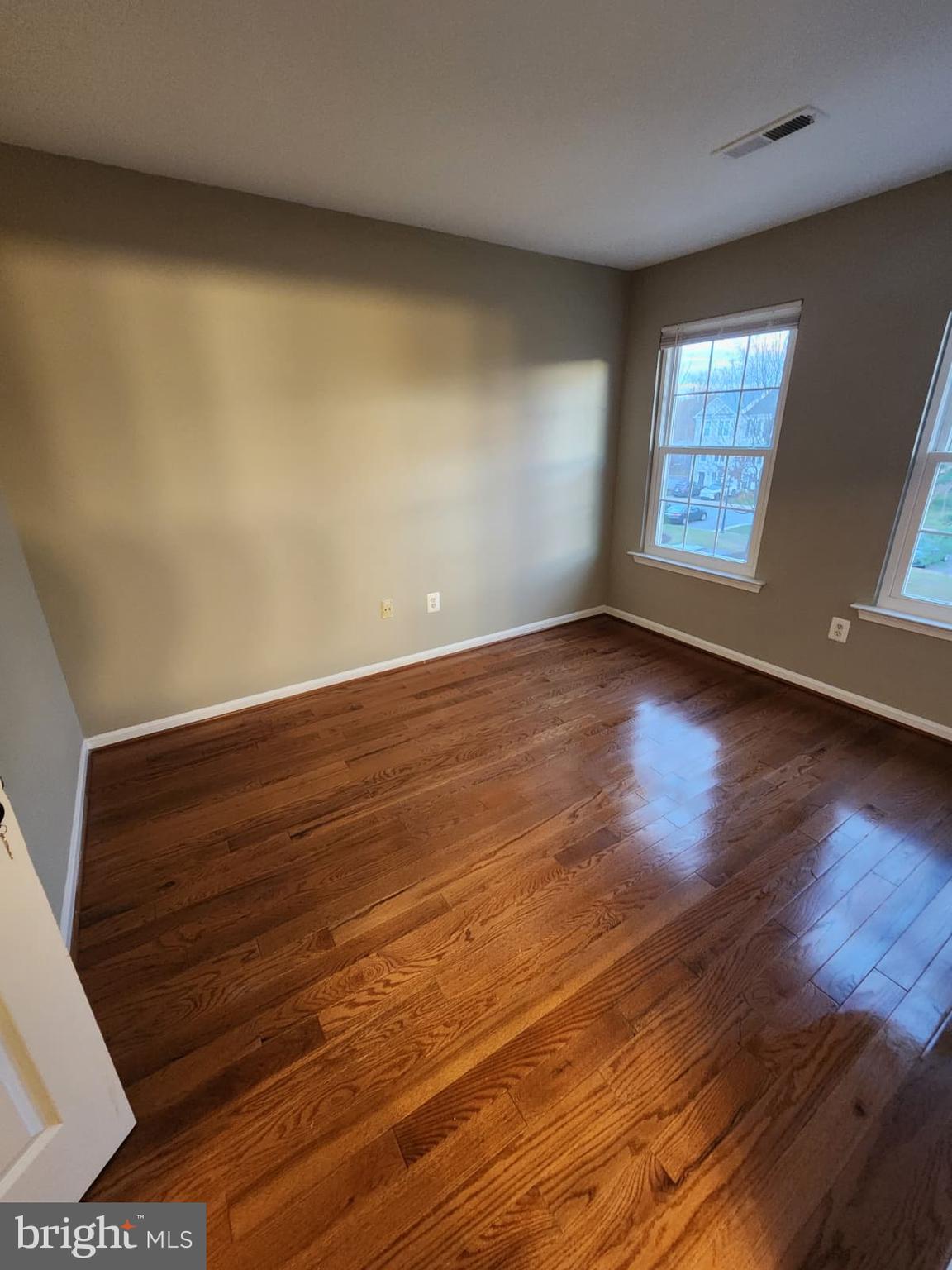 45033 Fellowship Square Ashburn, VA 20147 - Photo 27 of 37 wooden floor in an empty room with a window