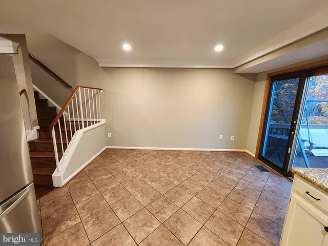 a large kitchen with cabinets and stainless steel appliances